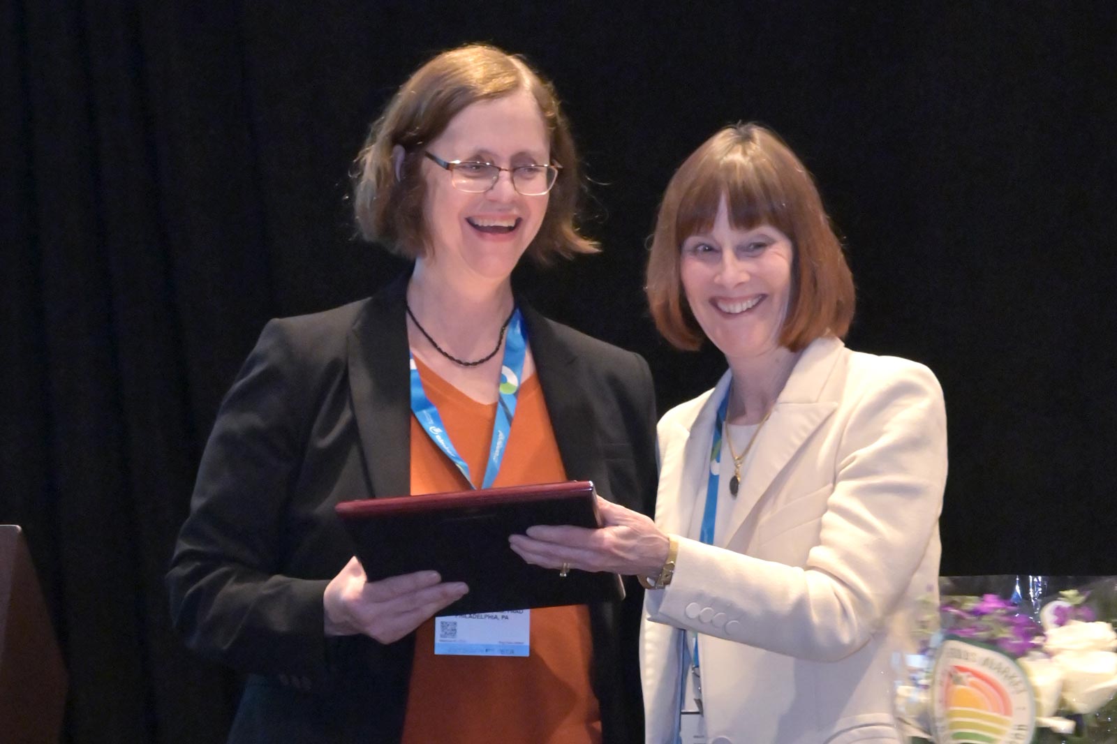 DF President Dr. Janet Fairley presents the Practitioner of the Year Award to Dr. Victoria Werth.