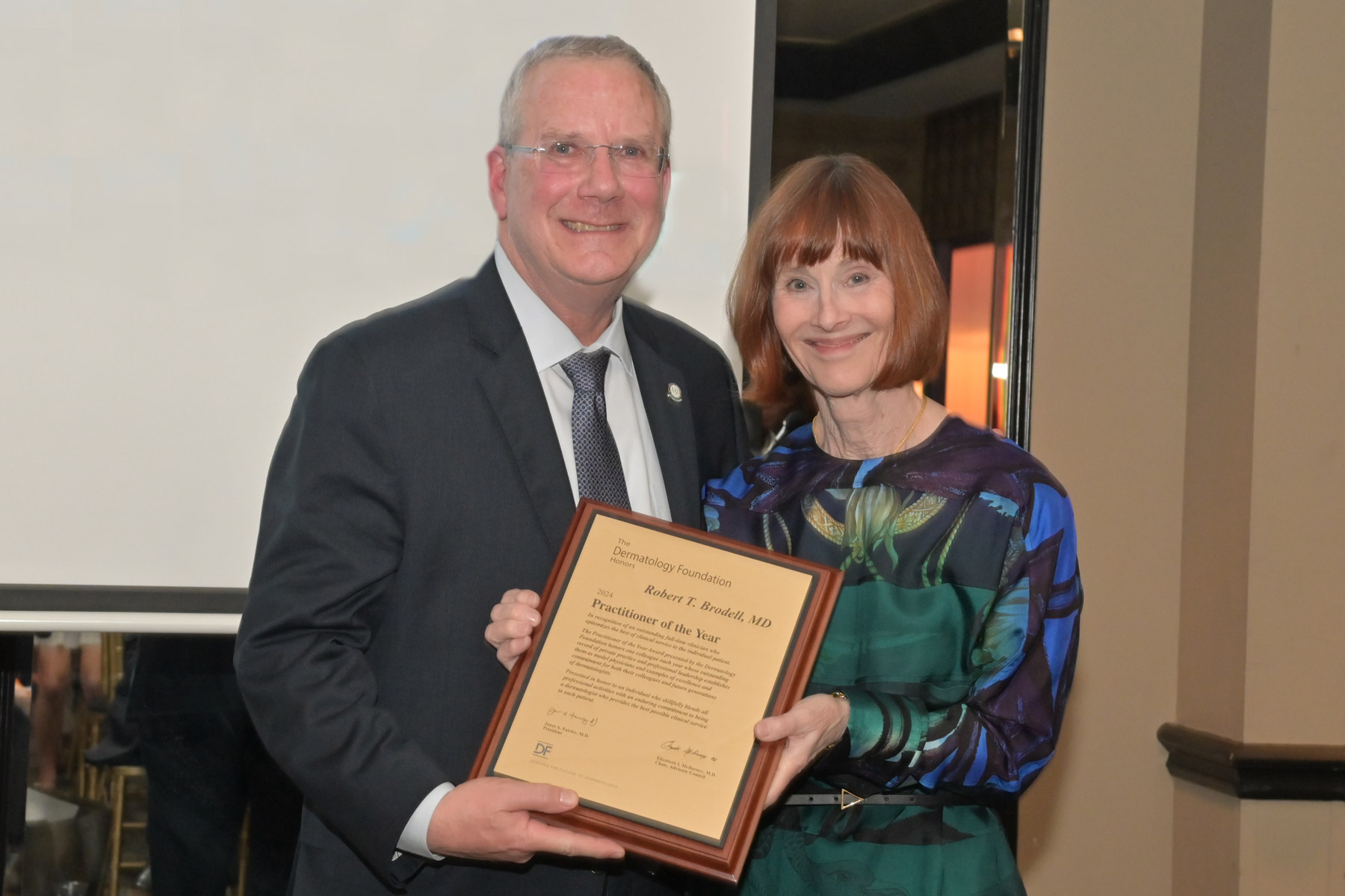 Dr. Robert Brodell receives the 2024 DF Practitioner of the Year Award from Foundation President Dr. Janet Fairley.