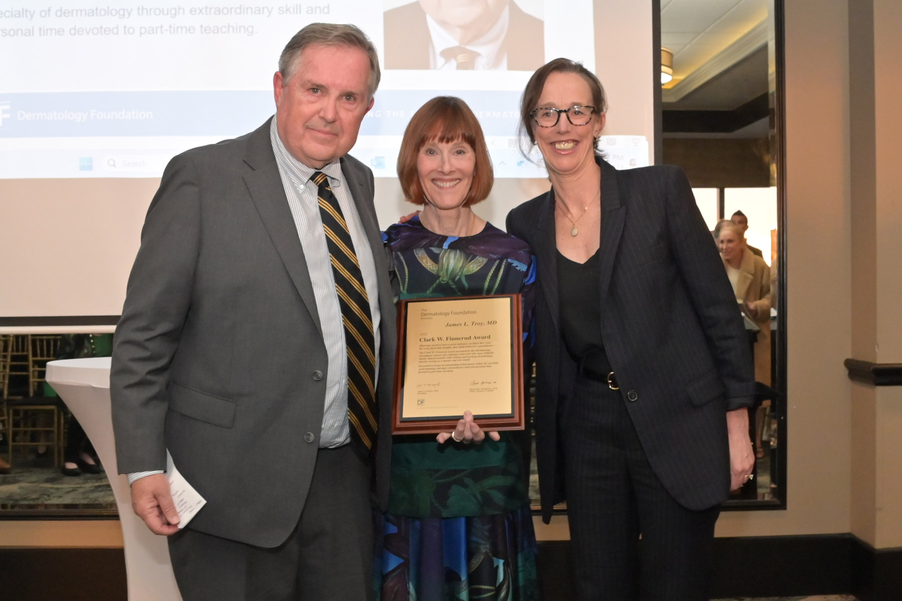 2024 DF Clark W. Finnerud Award recipient Dr. James Troy, DF President Dr. Janet Fairley (center), and Dr. Beth Drolet.