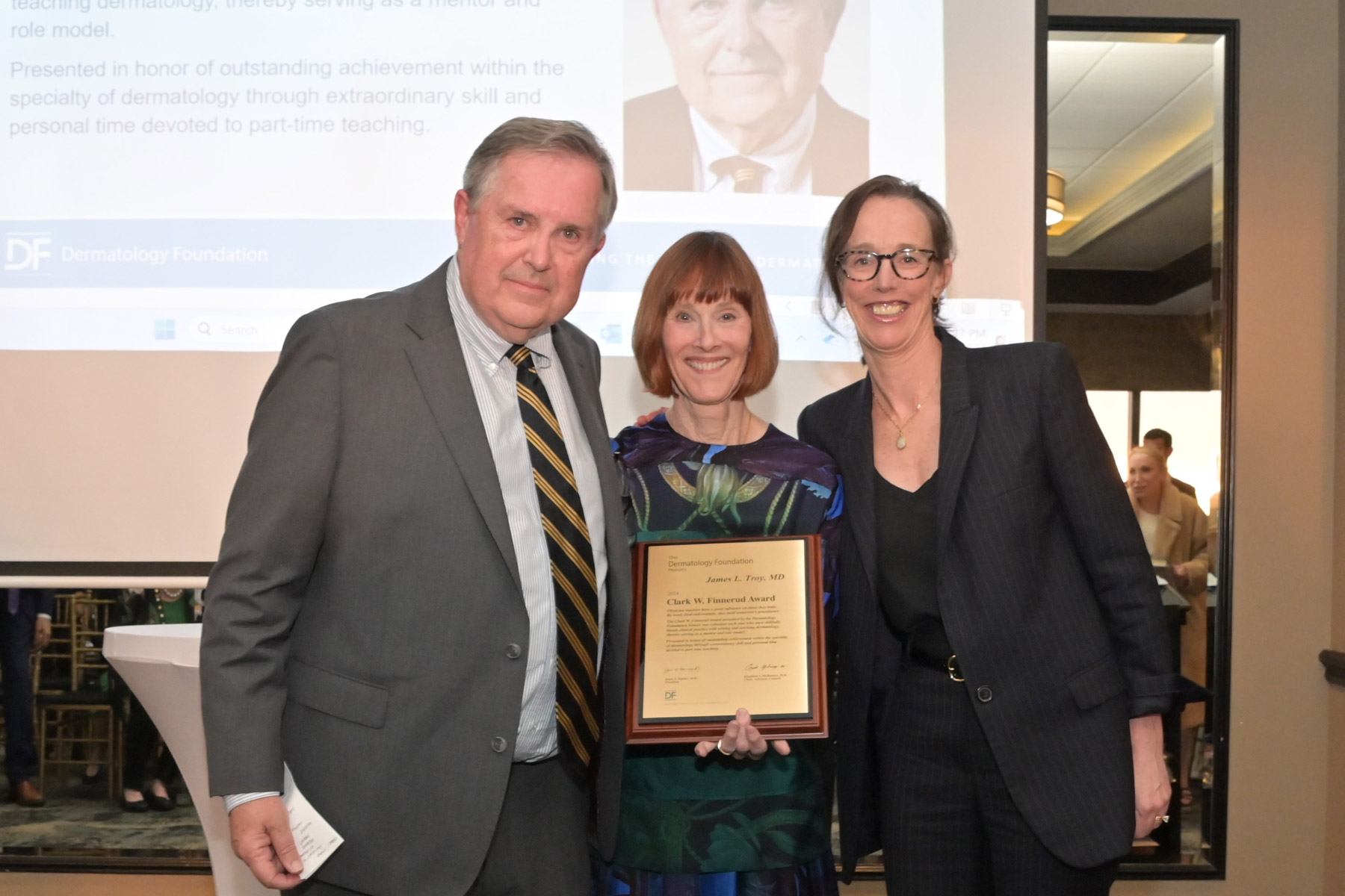 2024 DF Clark W. Finnerud Award recipient Dr. James Troy, Dr. Janet Fairley (center), and Dr. Beth Drolet.