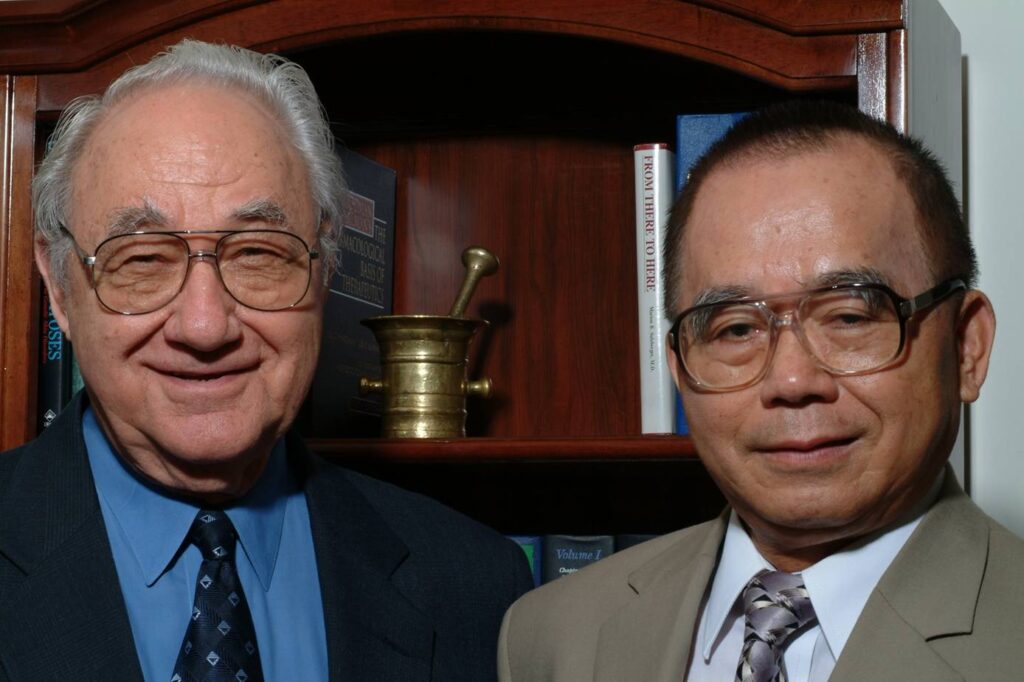Two men smiling at the camera