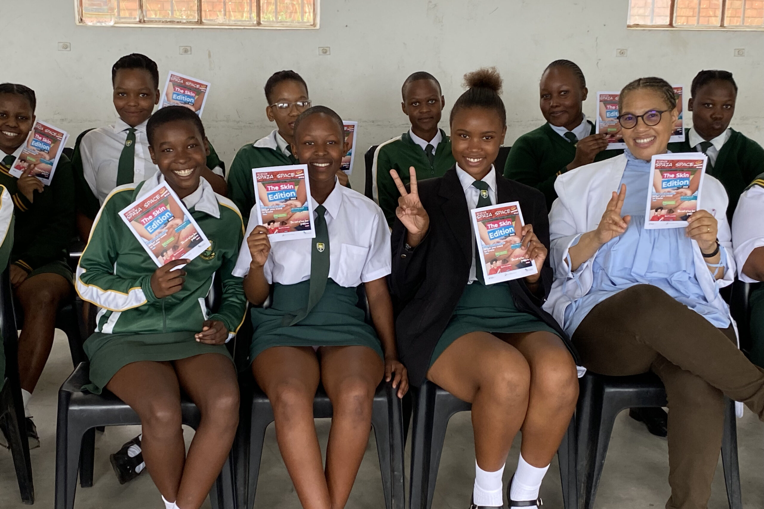 Seated group of smiling female and male students